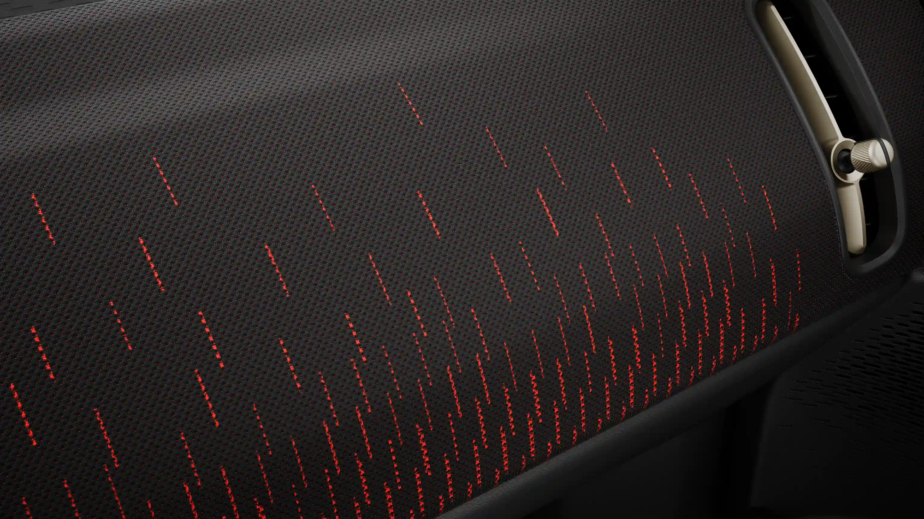 Prikaz na potpuno električnu nadzornu ploču MINI Countryman modela s JCW Style opremom u crvenoj i crnoj boji