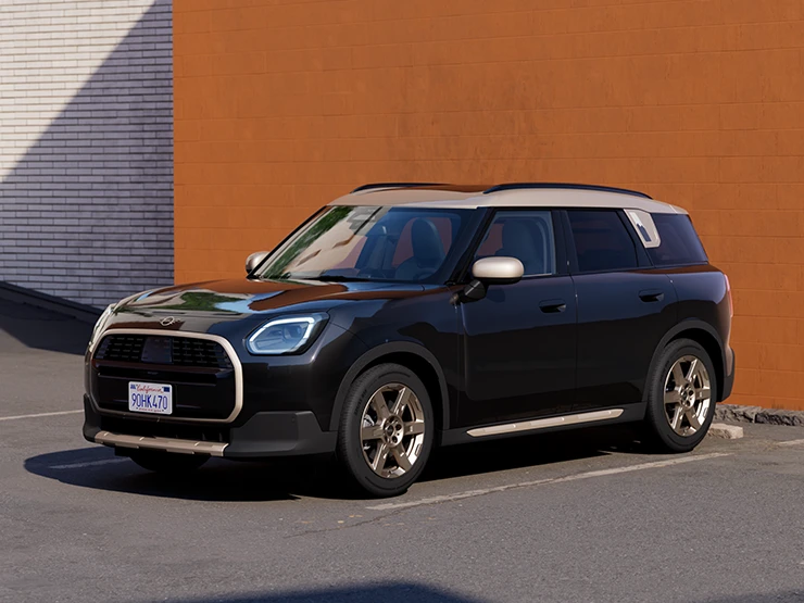 Prikaz prednjeg kraja MINI Countryman modela u Midnight Black boji i krovu Vibrant Silver boje na parkingu.