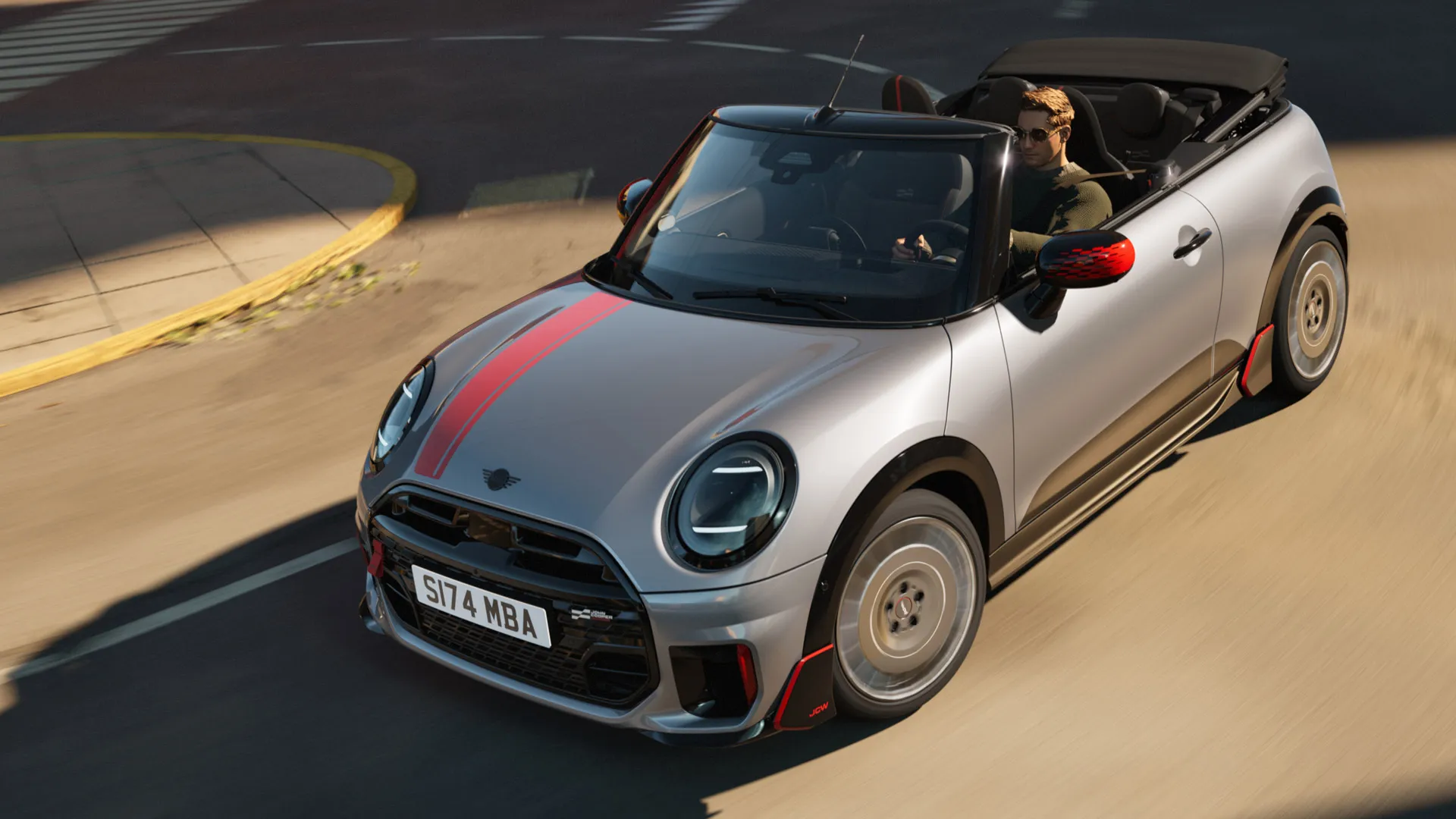 Prikaz prednjeg kraja MINI Cabrio modela s prikazom sportskih John Cooper Works naljepnica u Chili Red boji.