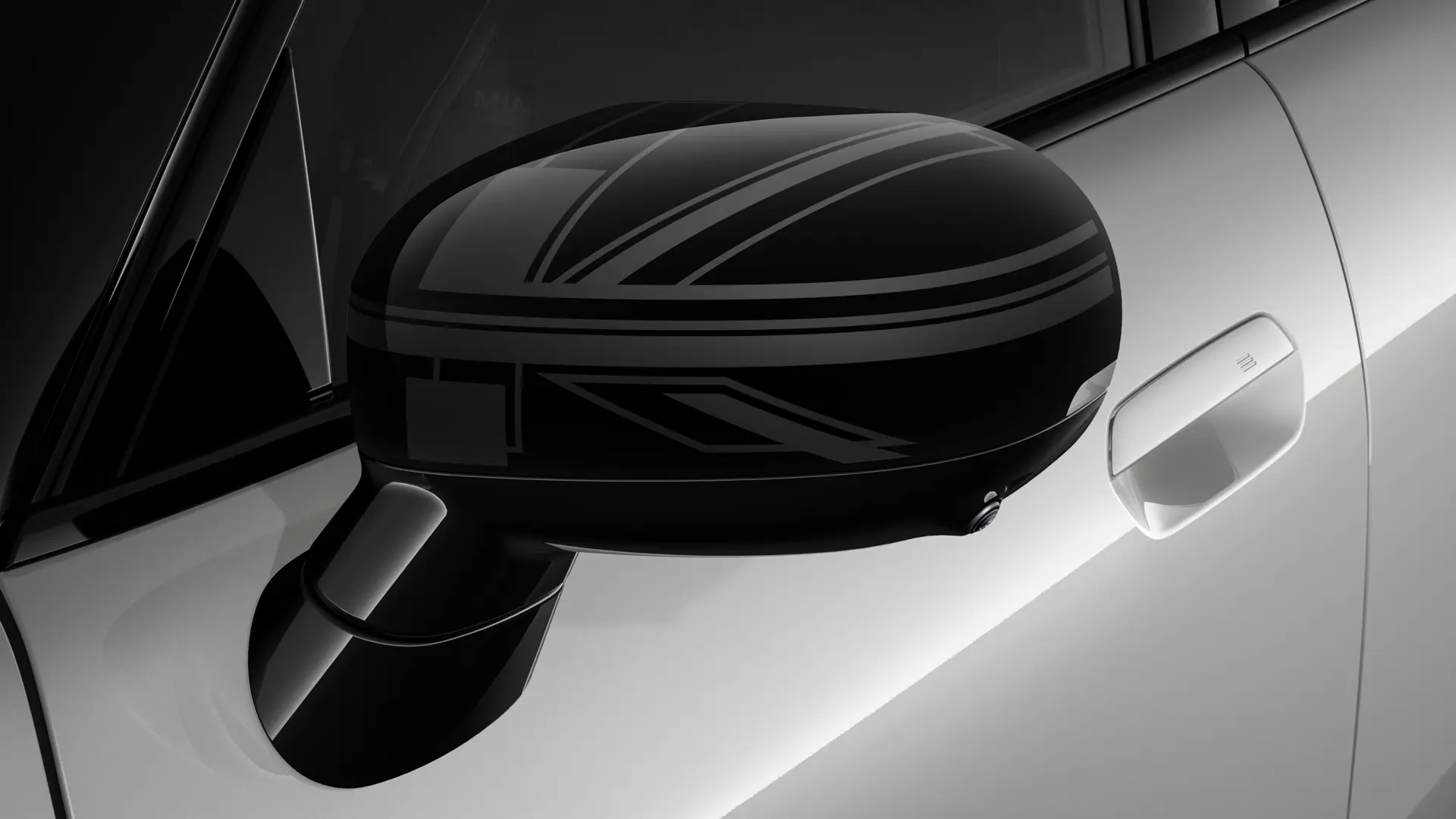 MINI Cooper 3-vrata u srebrnoj boji s poklopcima vanjskih retrovizora u Night Union Jack dizajnu.